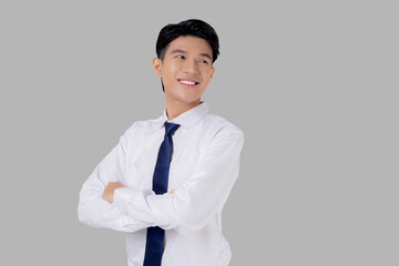 Portrait businessman with crossed his arms standing isolated on white background, young asian business man is manager or executive having confident is positive with success.