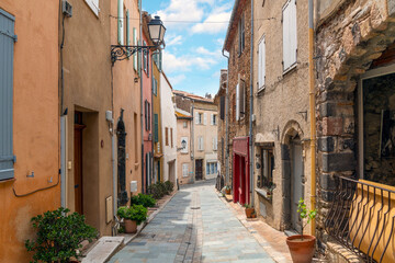 Fototapeta na wymiar A charming, picturesque street in the medieval village of Grimaud, France, in the hills above Saint-Tropez along the French Riviera.