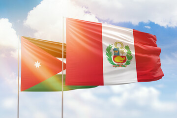 Sunny blue sky and flags of peru and jordan