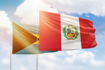 Sunny blue sky and flags of peru and bahamas