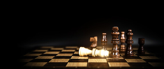 Close-up king chess stand on falling chess concepts of competition challenge of leader business...