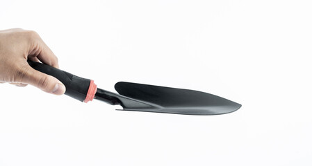 hand holding shovel background material