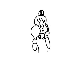 鏡を見て浮かない顔の女性