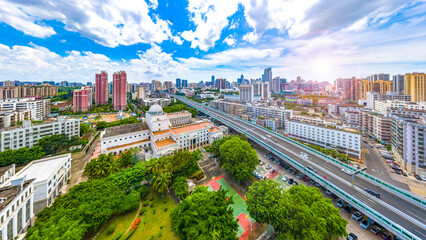 Haikou Cityscape with Landmark Buildings and Urban Overpass during Sunny Daytime, Hainan Province, the Largest Free Trade Zone in China.