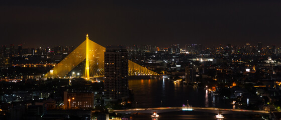 Banner of Citiscape of Bangkok, Thailand at Night with View of Rama VIII Bridge