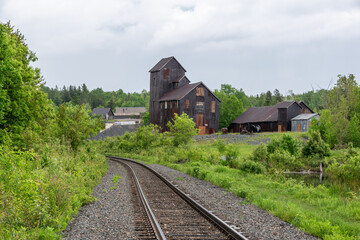 A railway track runs alongside an old mine in the small former mining town of Cobalt, Ontario.