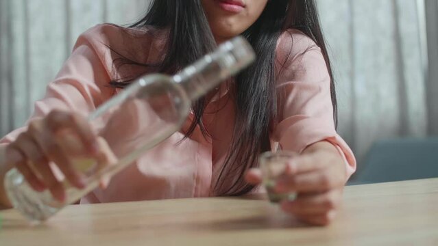 Close Up Of Drunk Asian Woman With Smartphone On Table Drinking Vodka And Sleeping At Home
