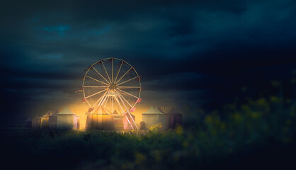 Old carnival with a ferris wheel on a cloudy night. 3D rendering, illustration