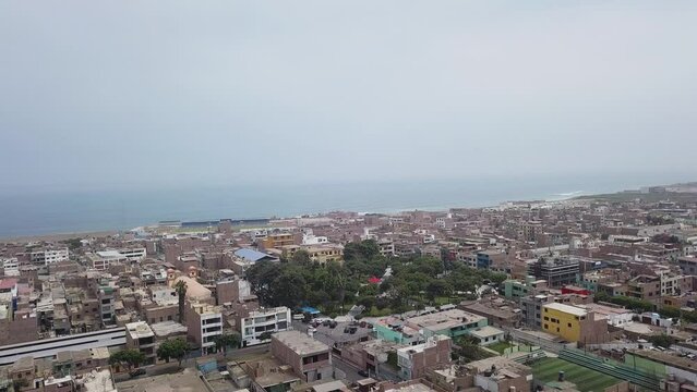 aerial drone view of Chancay square, lima, peru and the sea in 4k