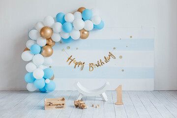 Birthday decorations with balloons. Festive room decoration in blue color with balloons. Room decoration for a birthday for a child. First birthday