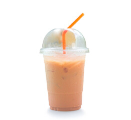 Orange Thai iced condensed milk tea in transparent plastic glass with straw isolated on white background with clipping path