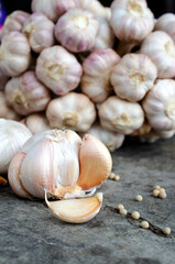 Still life of garlic cloves raw food on vintage wood table backgrounds