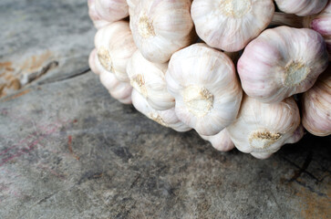 Close up off Garlic vegetable on wooden table for food backgrounds concept