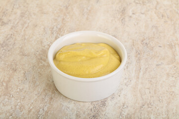 Organic mustard sauce in the bowl