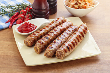 Grilled sausages with cabbage and sauce