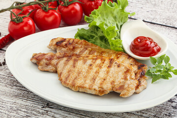 Grilled pork steak with ketchup