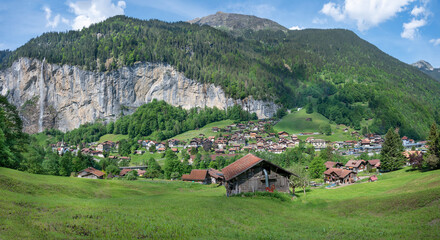 Landscape of  Lauterbrunnen village, the Staubbach Fall  and the Lauterbrunnen Wall in Swiss Alps,...
