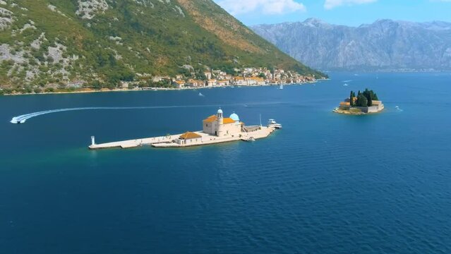 Montenegro. Bay of Kotor. The island of St. George and the Island of Gospa od Skrpela are located near the city of Perast. Popular tourist spot. Drone. The camera moves from right to left