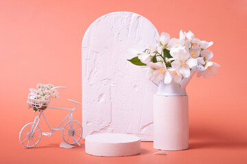 Natural beauty pedestal. Empty cosmetics podiums for product on pink background with jasmine...