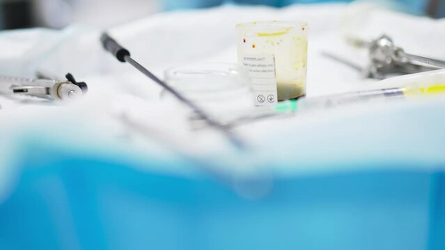 Instruments and tools prepared for surgery. Devices at the table close up. Blurred foreground transforms into blurred backdrop.