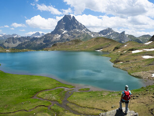 Mountaineer on Lake Gentau with the Midi d Ossau in the background, French Pyrenees
