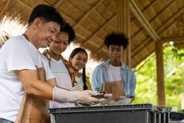 Happiness children study learning to prepare the soil before planting vegetables.
