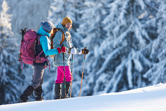 Two People In The Mountains In Winter