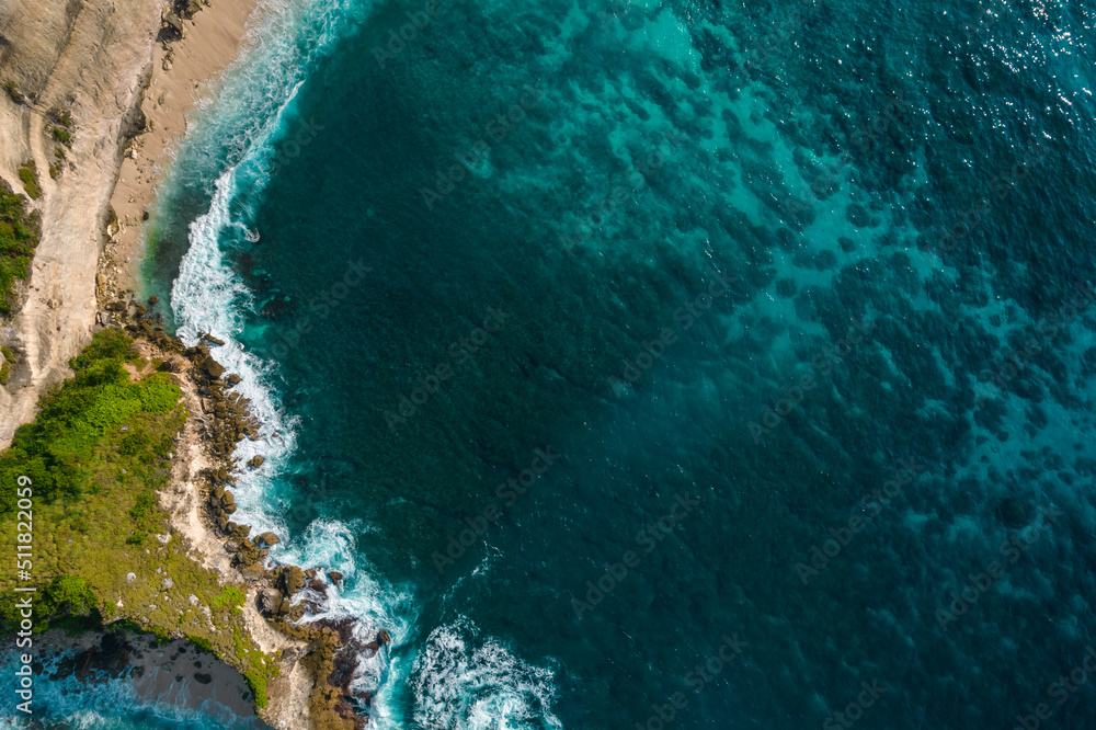 Wall mural aerial drone top view shot of rocky beach with cliff. indian ocean shore. copy space for text. natur - Wall murals