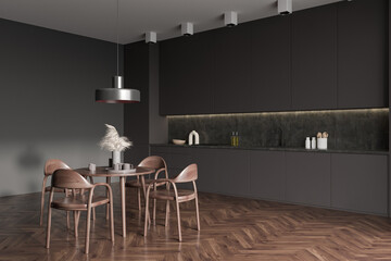 Grey kitchen interior with eating table and seats on wooden floor