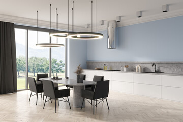 Light kitchen interior with eating table and seats, kitchenware and window