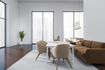 Kitchen interior with chill area and bar island with seats, panoramic window