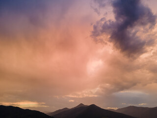 overcast sunset above mountains