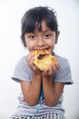 Asian little girl having breakfast in white background