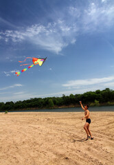 boy running kite