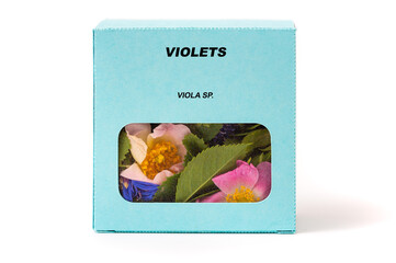 Violets Medicinal herbs in a cardboard box. Herbal tea in a gift box