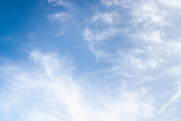 Cirrus clouds on a bright blue summer sky 