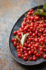Gumi berries in antique tray