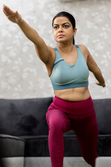 Fototapeta na wymiar Beautiful attractive young woman doing yoga exercising at home