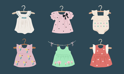 baby clothes hanging on rope