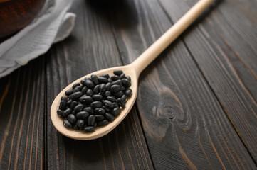 Fototapeta na wymiar Fresh organic natural beans on wooden rustic black background