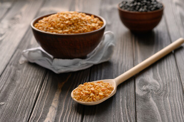 Fresh organic natural peas on a wooden rustic black background