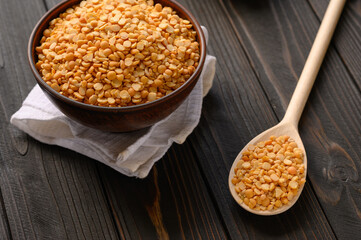 Fresh organic natural peas on a wooden rustic black background
