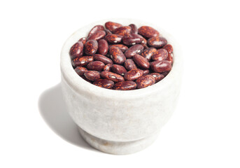 Red beans in marble bowl isolated on white background.