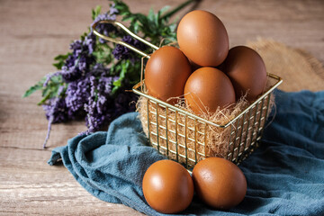 fresh chicken eggs in a metal basket