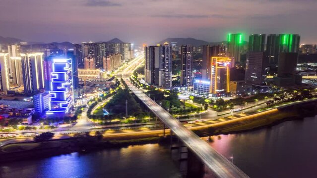 view aerial city streets river bridge light traffic time-lapse photography/guangdong jiangmen at night