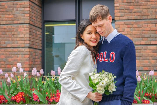 Newly married couple of different nationalities Out for a prewedding photoshoot in London. The man is British Asian women