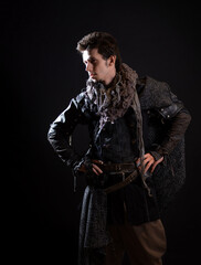 A guy in a steampunk or post-apocalyptic image, portrait on a black background