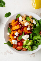 Vegan pumpkin salad with chick pea and avocado top view