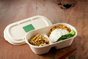 Delicious Chinese food, sour beans with minced meat. takeaway box