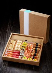 A delicious combination of Japanese sushi dishes ,in a paper takeaway package